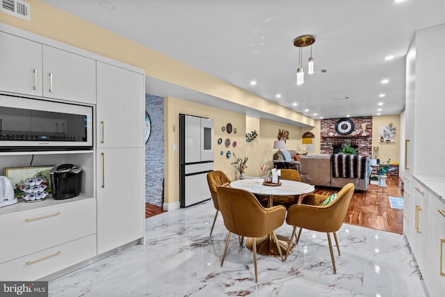 95 Meadowfield Dr, Southampton, PA 18966 - dining area with recessed lighting, light marble finish flooring, and a fireplace