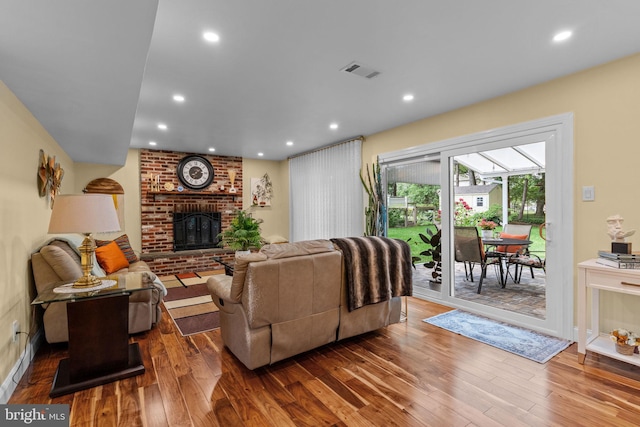 95 Meadowfield Dr, Southampton, PA 18966 - living room featuring wood finished floors, a brick fireplace, recessed lighting, and baseboards