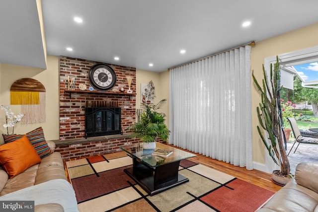 95 Meadowfield Dr, Southampton, PA 18966 - living area with wood finished floors, a brick fireplace, recessed lighting, and baseboards