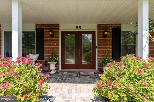 95 Meadowfield Dr, Southampton, PA 18966 - view of exterior entry featuring french doors, covered porch, and brick siding