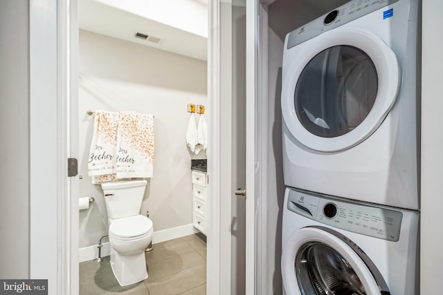 1603 S 6th St, Philadelphia, PA 19148 - washroom featuring estacked washer and dryer and tile patterned flooring