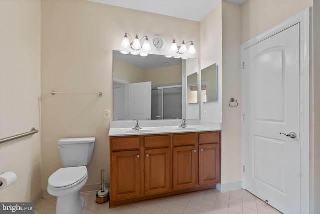 902 Macphail Woods Xing Unit 2I, Bel Air, MD 21015 - full bathroom featuring double vanity, a shower with shower door, toilet, baseboards, and tile patterned flooring