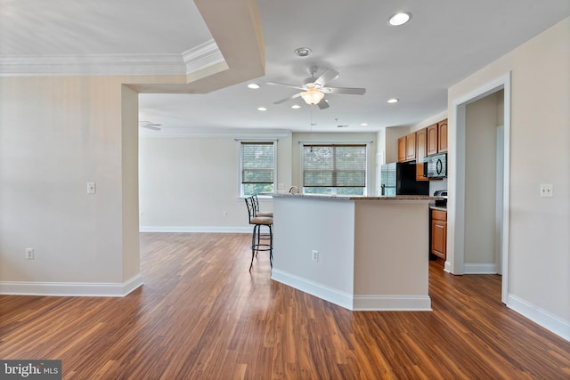902 Macphail Woods Xing Unit 2I, Bel Air, MD 21015 - kitchen featuring black appliances, ceiling fan, a breakfast bar, crown molding, and recessed lighting