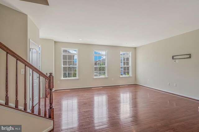 12310 Sandstone St, Waldorf, MD 20601 - unfurnished living room featuring hardwood / wood-style flooring and stairs