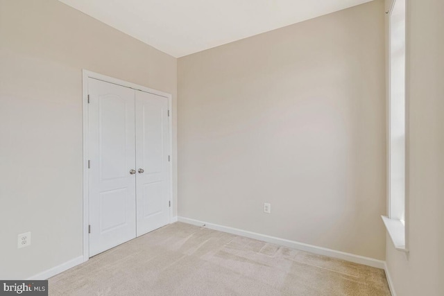 12310 Sandstone St, Waldorf, MD 20601 - unfurnished bedroom featuring light colored carpet and a closet