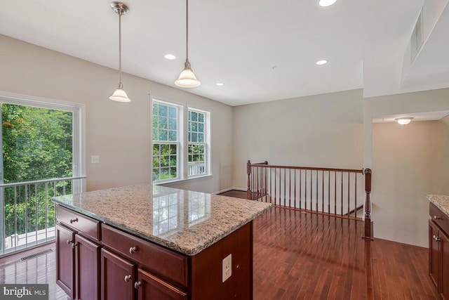 12310 Sandstone St, Waldorf, MD 20601 - kitchen with dark wood-type flooring, hanging light fixtures, light stone counters, recessed lighting, and a kitchen island
