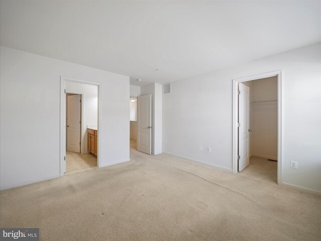 18238 Hurricane Ct, Hagerstown, MD 21740 - unfurnished bedroom with a walk in closet, light colored carpet, a closet, and ensuite bath