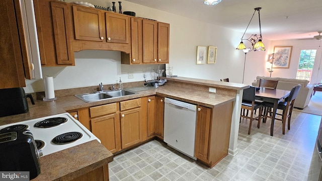 5934 Tappan Ln, Salisbury, MD 21801 - kitchen featuring white appliances, a sink, a peninsula, decorative light fixtures, and brown cabinetry