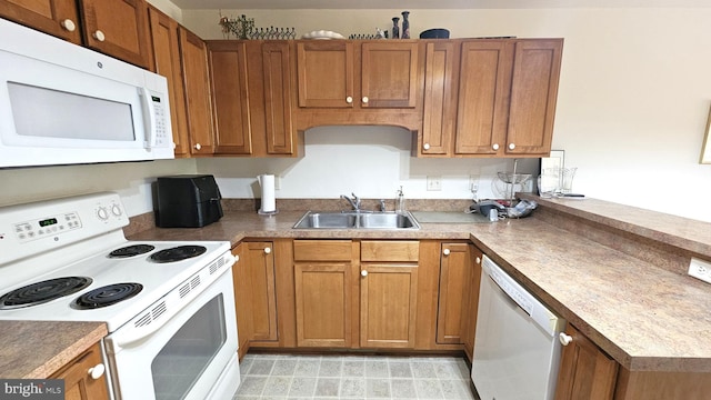 5934 Tappan Ln, Salisbury, MD 21801 - kitchen with white appliances, a sink, and brown cabinetry