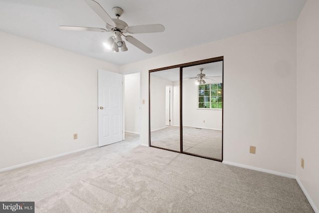10729 Freds Oak Ct, Burke, VA 22015 - unfurnished bedroom featuring carpet, baseboards, a closet, and a ceiling fan