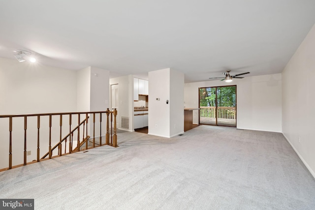 10729 Freds Oak Ct, Burke, VA 22015 - unfurnished room featuring light colored carpet, a ceiling fan, and baseboards