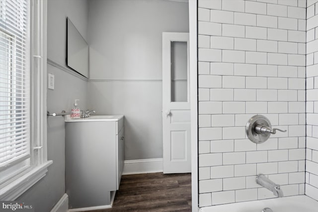 2434 N 26th St, Philadelphia, PA 19132 - full bathroom with vanity, wood finished floors, shower / bathtub combination, and baseboards
