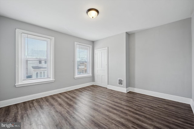 2434 N 26th St, Philadelphia, PA 19132 - empty room featuring dark wood-style floors and baseboards