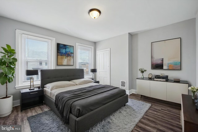 2434 N 26th St, Philadelphia, PA 19132 - bedroom with multiple windows, wood finished floors, and baseboards