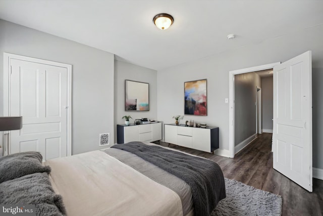2434 N 26th St, Philadelphia, PA 19132 - bedroom with dark wood-style floors and baseboards