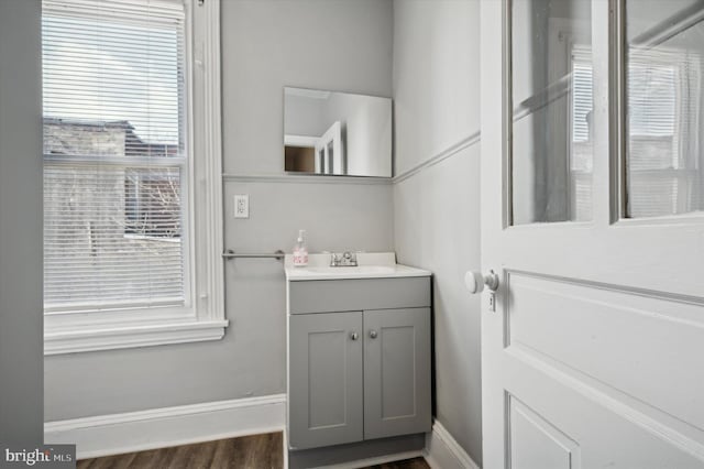 2434 N 26th St, Philadelphia, PA 19132 - bathroom with vanity, baseboards, and wood finished floors