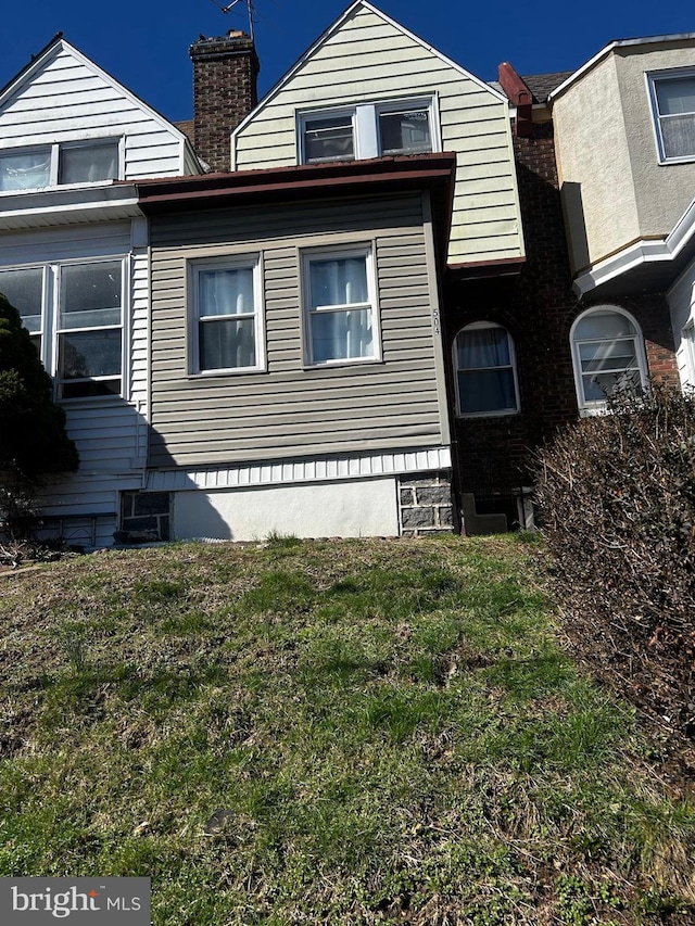 504 Woodcliffe Rd, Upper Darby, PA 19082 - view of front of home with a front yard and a chimney