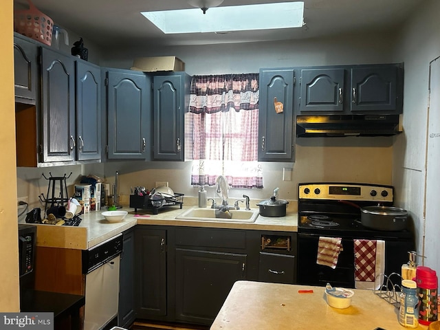 504 Woodcliffe Rd, Upper Darby, PA 19082 - kitchen featuring range with electric cooktop, a sink, a skylight, under cabinet range hood, and light countertops