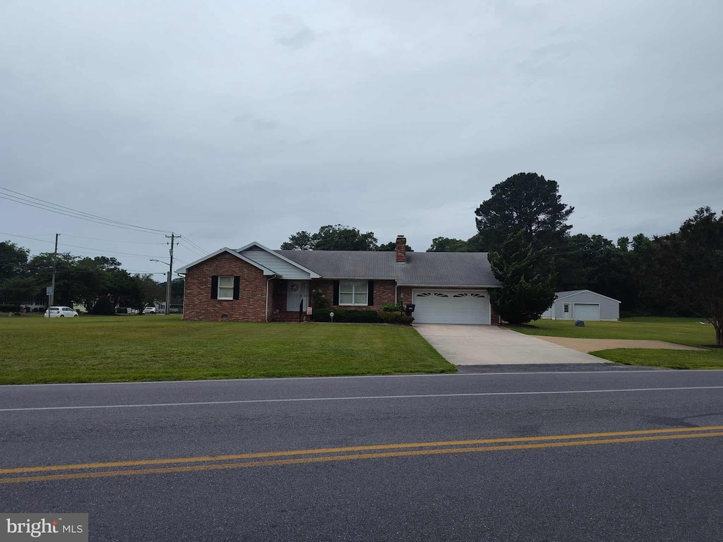 350 Tilghman Rd, Salisbury, MD 21804 - ranch-style house featuring driveway, an attached garage, a chimney, a front yard, and brick siding