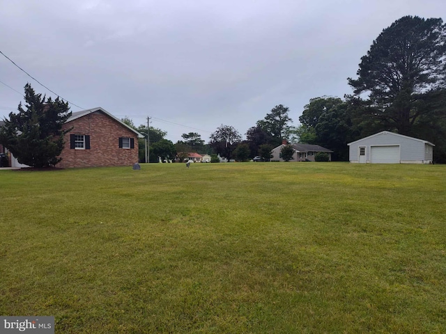 350 Tilghman Rd, Salisbury, MD 21804 - view of green lawn featuring a garage and an outdoor structure