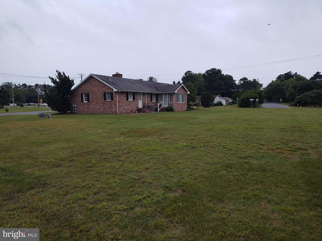 350 Tilghman Rd, Salisbury, MD 21804 - ranch-style home with a front lawn, brick siding, and a chimney