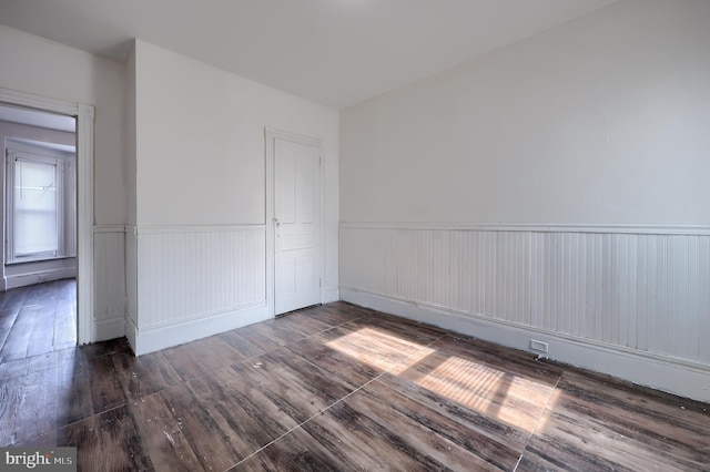 753 N 12th St, Reading, PA 19604 - empty room with wainscoting and hardwood / wood-style floors