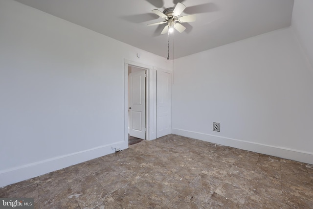753 N 12th St, Reading, PA 19604 - empty room with ceiling fan and stone finish floors