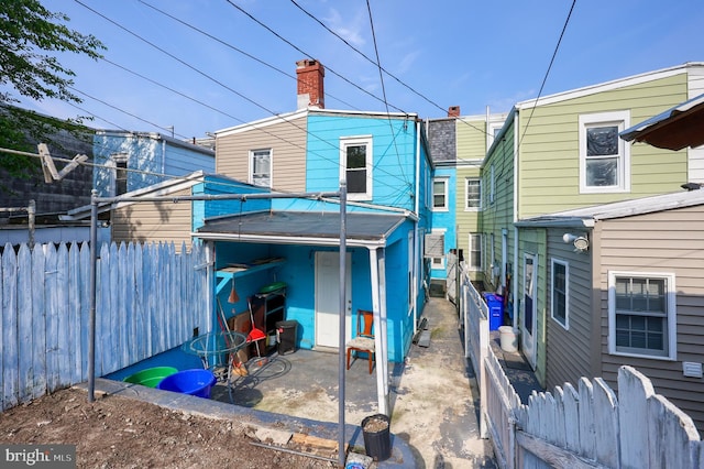 753 N 12th St, Reading, PA 19604 - back of property featuring a fenced backyard and a patio area