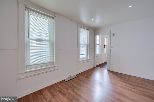 753 N 12th St, Reading, PA 19604 - unfurnished room with light wood finished floors and a decorative wall
