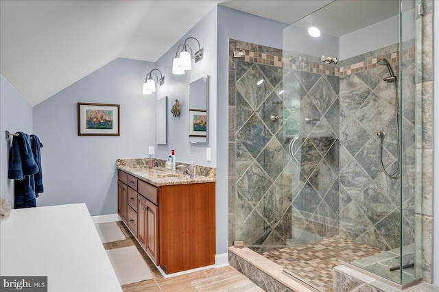 109 Great Circle Rd, Newark, DE 19711 - full bath with double vanity, a tile shower, vaulted ceiling, and baseboards