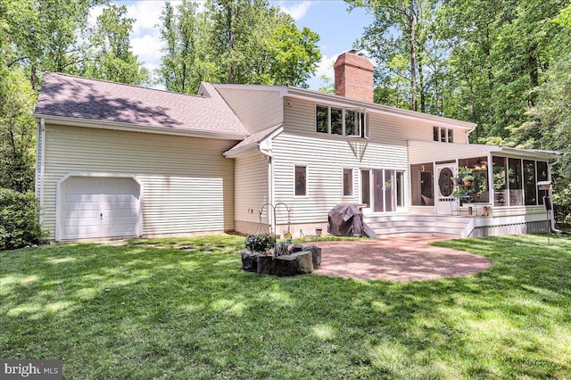 109 Great Circle Rd, Newark, DE 19711 - rear view of house featuring a sunroom, a chimney, a lawn, an attached garage, and a shingled roof