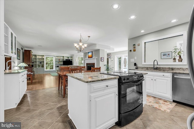 109 Great Circle Rd, Newark, DE 19711 - kitchen with black electric range oven, stainless steel dishwasher, tile patterned floors, a kitchen island, and open floor plan