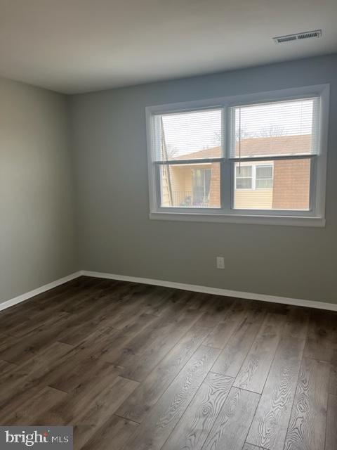 8 Florence Tollgate Pl, Florence, NJ 08518 - empty room featuring dark wood-style floors and baseboards