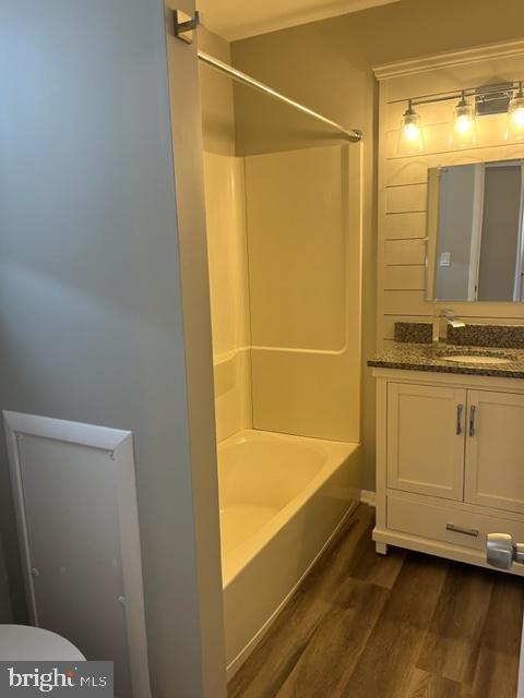 8 Florence Tollgate Pl, Florence, NJ 08518 - bathroom featuring wood finished floors, vanity, shower / washtub combination, and toilet