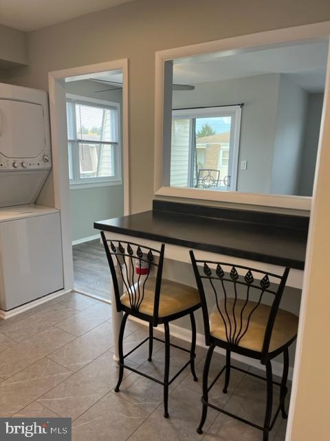 8 Florence Tollgate Pl, Florence, NJ 08518 - dining area featuring estacked washer and dryer and baseboards