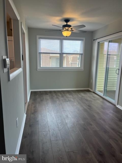 8 Florence Tollgate Pl, Florence, NJ 08518 - spare room with plenty of natural light, dark wood-style floors, and baseboards