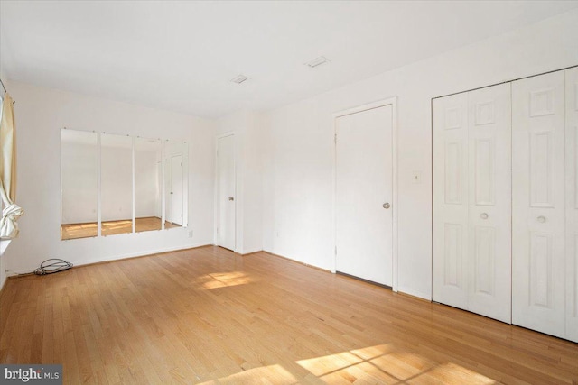 13637 Winterspoon Ln Unit 18, Germantown, MD 20874 - unfurnished bedroom with light wood-style floors