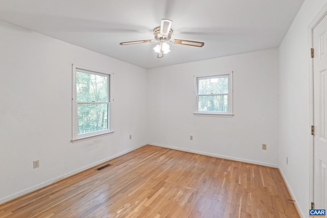 406 Green Meadow Ln, Scottsville, VA 24590 - empty room with light wood-style flooring, ceiling fan, and baseboards
