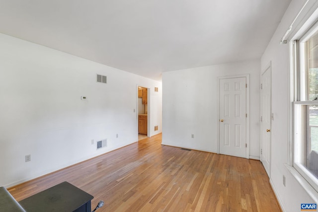 406 Green Meadow Ln, Scottsville, VA 24590 - unfurnished living room featuring light wood finished floors and baseboards