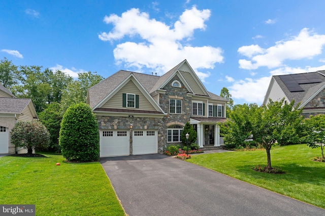 505 Sherwood Mills Ct, Sandy Spring, MD 20860 - view of front facade featuring stone siding, driveway, a front yard, and a garage