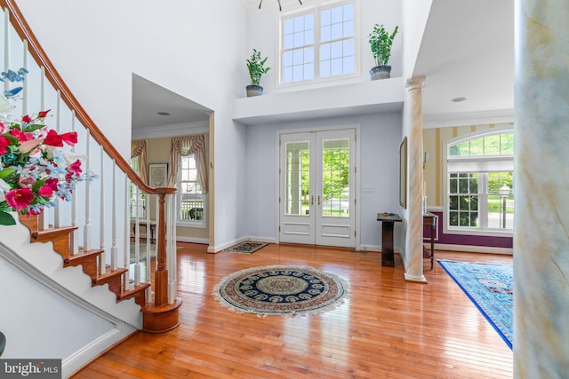 505 Sherwood Mills Ct, Sandy Spring, MD 20860 - entryway with stairway, crown molding, hardwood / wood-style flooring, baseboards, and a high ceiling
