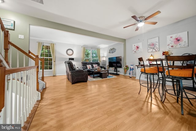 5341 Yellow Turtle Pl, Woodbridge, VA 22193 - living area featuring ceiling fan, light wood-style floors, and stairway