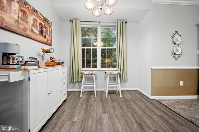 5341 Yellow Turtle Pl, Woodbridge, VA 22193 - dining area with wood finished floors and a chandelier