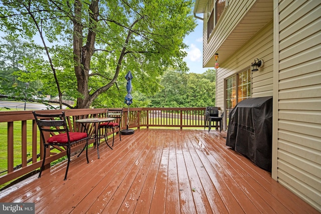 5341 Yellow Turtle Pl, Woodbridge, VA 22193 - wooden deck featuring outdoor dining space, grilling area, and view of wooded area