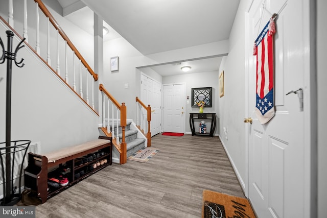 5341 Yellow Turtle Pl, Woodbridge, VA 22193 - foyer entrance featuring stairs and wood finished floors