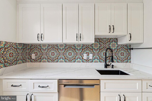 2254 12th St NW, Washington, DC 20009 - kitchen with dishwasher, a sink, and white cabinetry