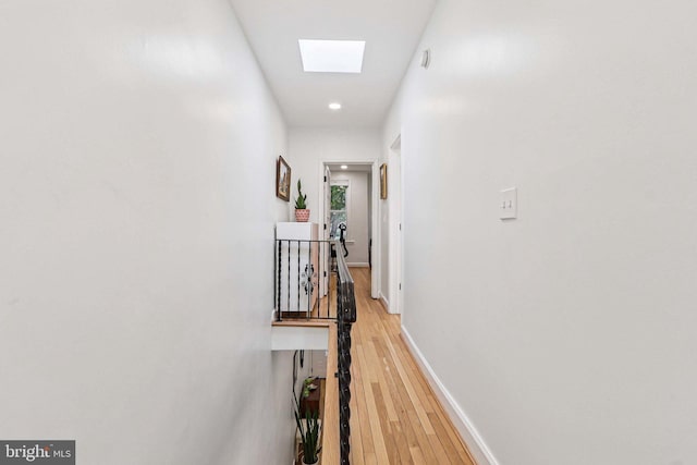 2254 12th St NW, Washington, DC 20009 - hallway with light wood-type flooring, a skylight, an upstairs landing, baseboards, and recessed lighting