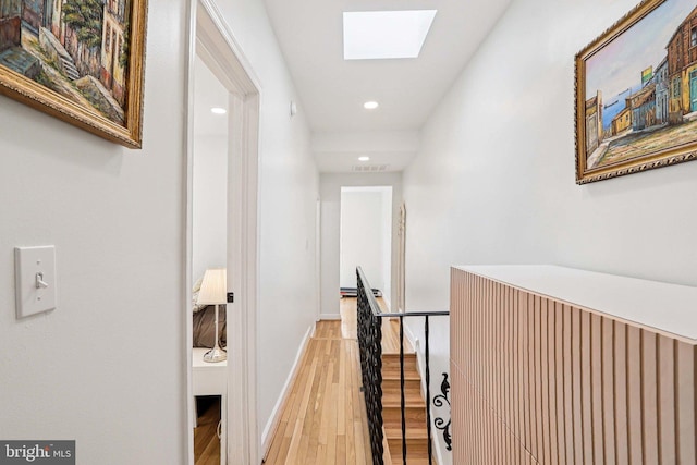 2254 12th St NW, Washington, DC 20009 - corridor with a skylight, light wood-style flooring, recessed lighting, baseboards, and an upstairs landing