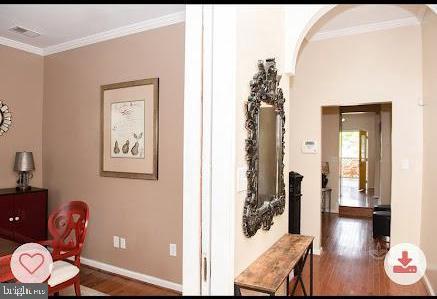 321 Elm St NW, Washington, DC 20001 - sitting room with wood finished floors, ornamental molding, baseboards, and arched walkways