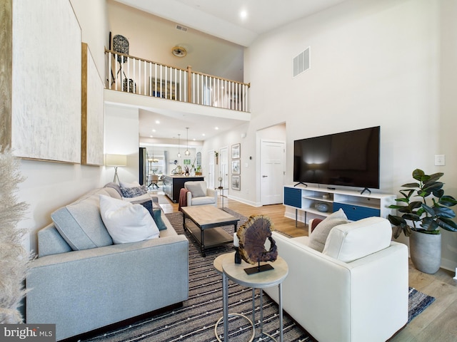 11020 Augusta Ln Unit 3, Berlin, MD 21811 - living area with wood finished floors, baseboards, and a towering ceiling